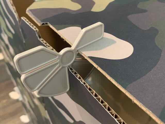 Connector attaching two panels of a camouflage printed kids play fort.