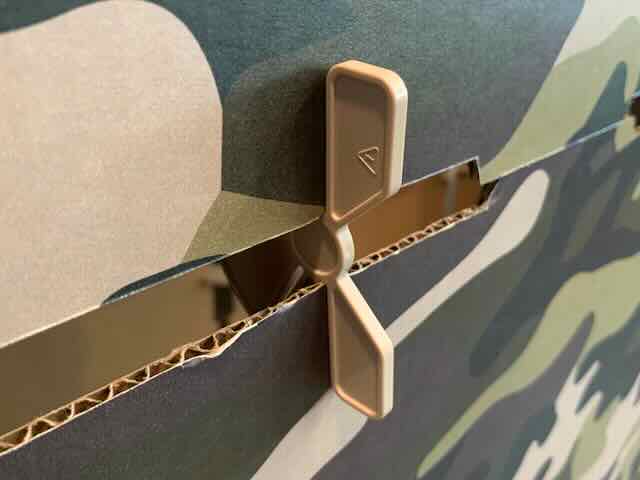 Two camouflage printed kids play for kit wall panels being held together by a plastic connector.
