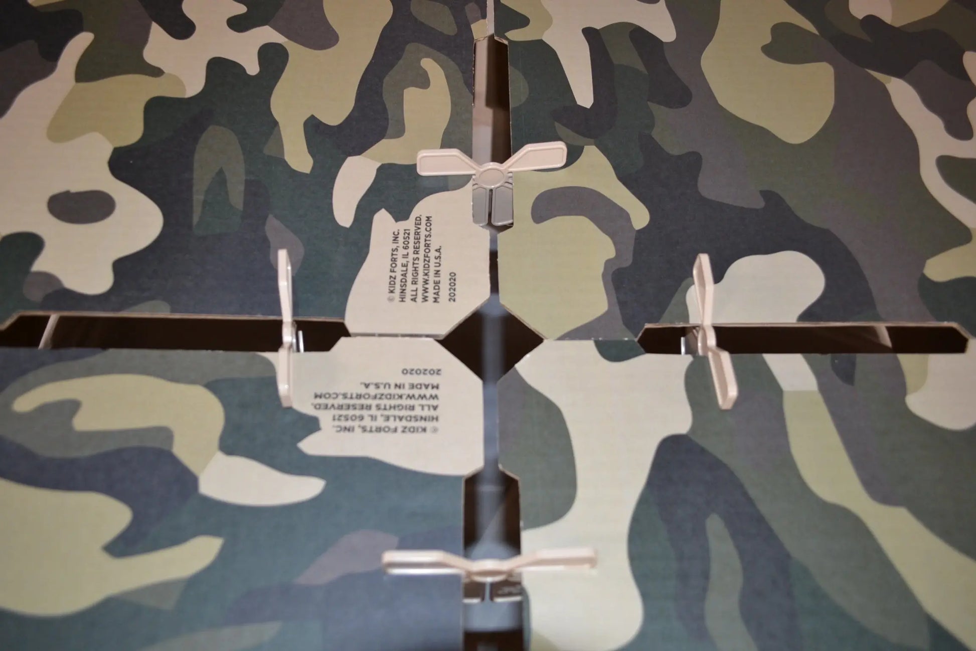Kidz Forts Commando fort building kit with camouflage-print corrugated panels and patented plastic connectors for easy assembly.