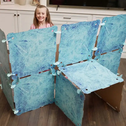 Kidz Forts Frosted Kit cardboard panels with blue ice design spread out before assembly, made from eco-friendly corrugated cardboard.